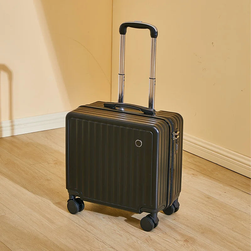 Black suitcase with wheels on a wooden floor against a beige wall