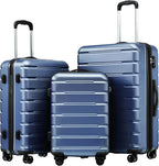 Set of three blue suitcases with black handles and wheels on a white background
