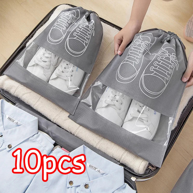 Gray shoe bags with white shoes inside, held open by a hand, with '10pcs' text on a suitcase.