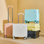 Set of colorful suitcases stacked and arranged on a wooden floor with a yellow wall background.