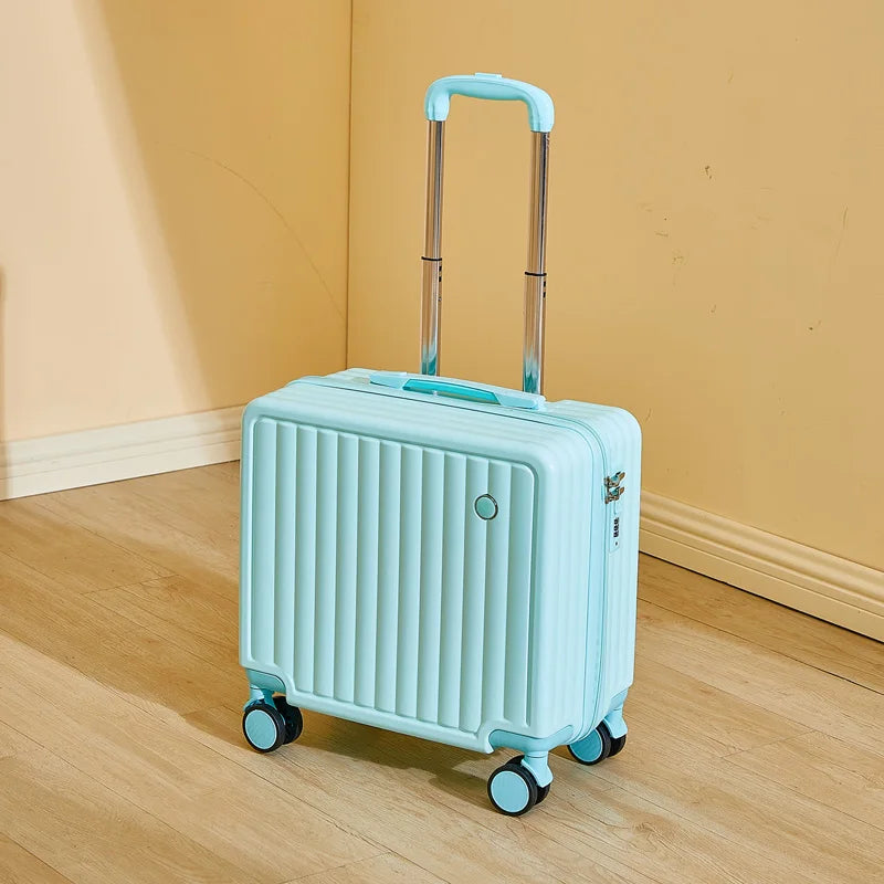 Light blue suitcase with wheels on a wooden floor against a beige wall