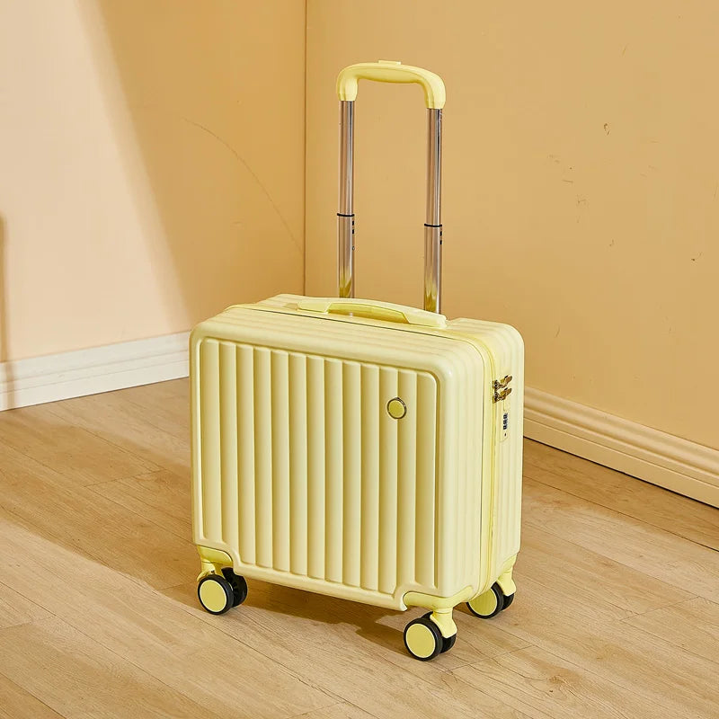 Yellow suitcase with wheels on a wooden floor against a beige wall